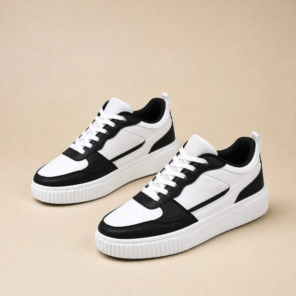 Ilka | Sneaker mit Plateausohle und Colorblock-Overlays in Schwarz – Premium Editorial