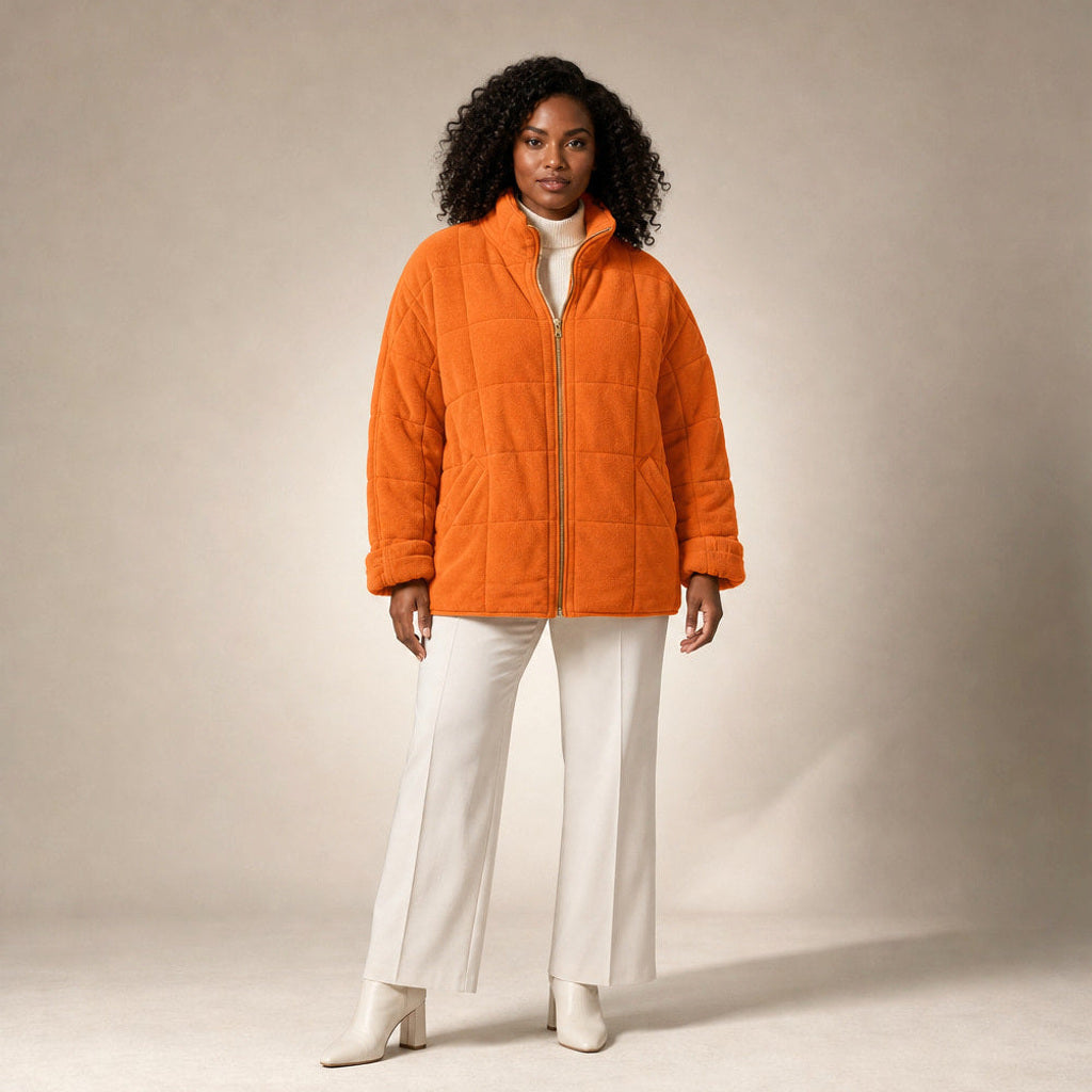 Lotte | Steppjacke mit schmalen Steppkanälen und lockerer Passform in Orange – Premium Editorial